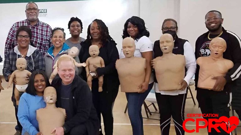 Group CPR training session in Austin with mannequins for certification.